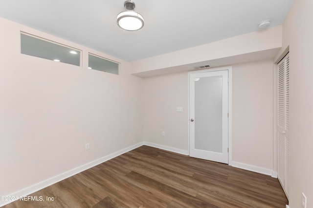 basement with dark wood-type flooring