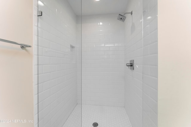 bathroom with tiled shower