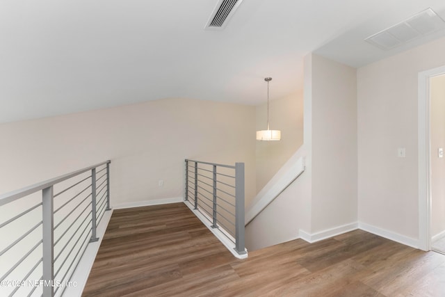 staircase featuring hardwood / wood-style flooring