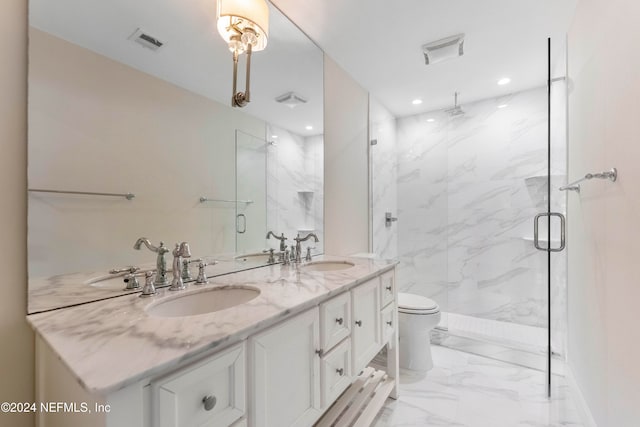 bathroom featuring vanity, toilet, and walk in shower