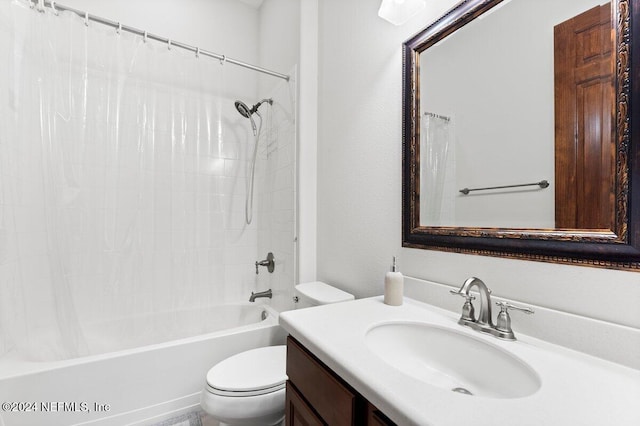 full bathroom featuring shower / bath combination with curtain, toilet, and vanity