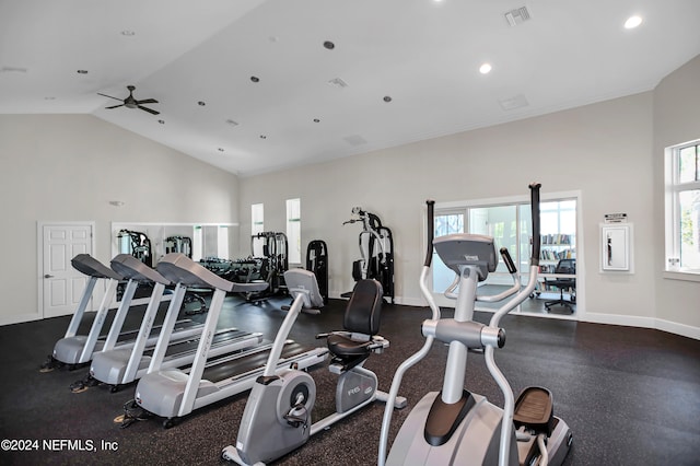 exercise room featuring ceiling fan and vaulted ceiling