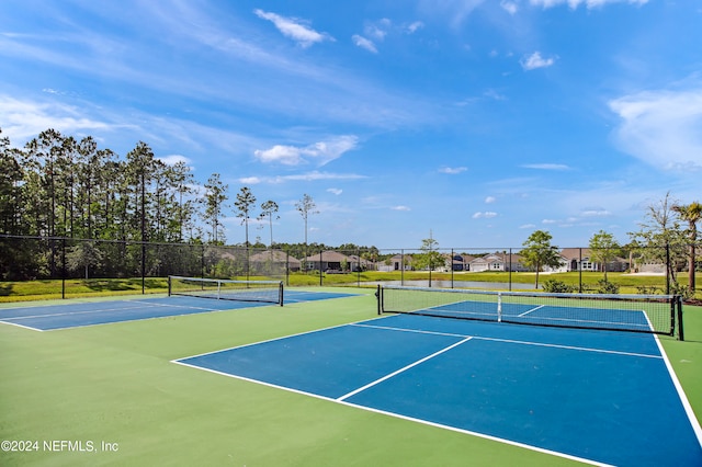 view of sport court featuring basketball hoop