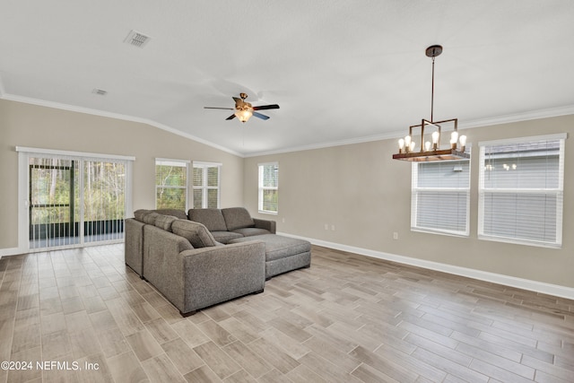 living room featuring light hardwood / wood-style flooring, a healthy amount of sunlight, and ceiling fan with notable chandelier