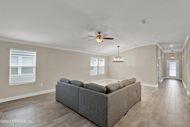 living room featuring vaulted ceiling, a wealth of natural light, and light wood-type flooring