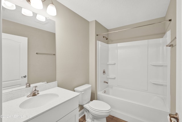 full bathroom with shower / tub combination, a textured ceiling, wood-type flooring, toilet, and vanity