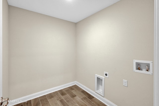 laundry room with hookup for an electric dryer, hardwood / wood-style floors, and washer hookup