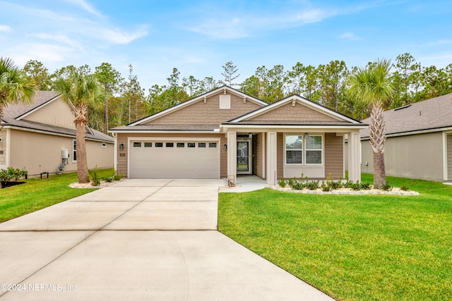 view of front facade with a front lawn and a garage