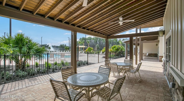 view of patio / terrace with a community pool and ceiling fan