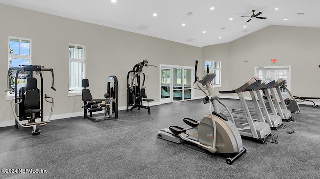 exercise room featuring high vaulted ceiling and ceiling fan