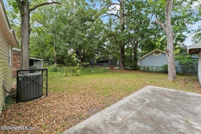 view of yard featuring a patio area and cooling unit