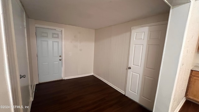 hall with dark hardwood / wood-style flooring