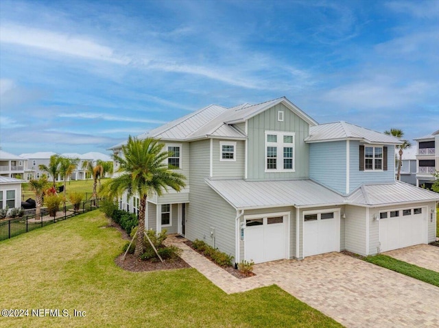 244 Rum Runner Way, Saint Johns, FL 32259 - view of front of home with a garage, decorative driveway, metal roof, and board and batten siding