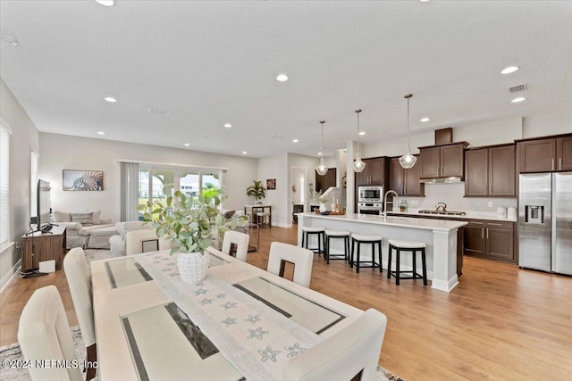 dining room featuring light hardwood / wood-style floors