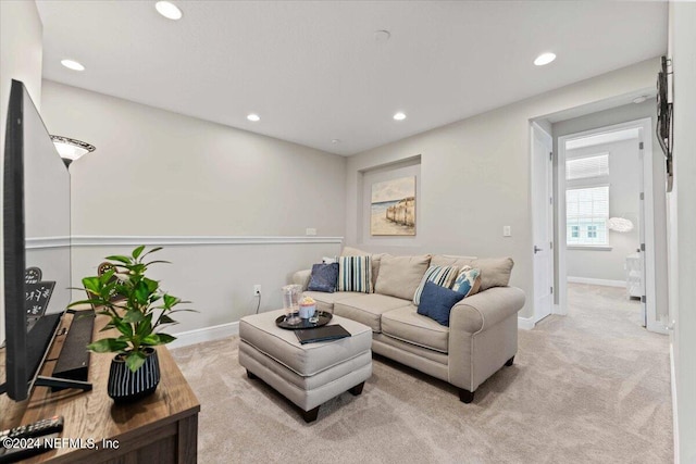 living room featuring light carpet