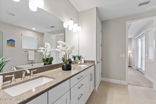 244 Rum Runner Way, Saint Johns, FL 32259 - full bath featuring baseboards, tile patterned flooring, and double vanity