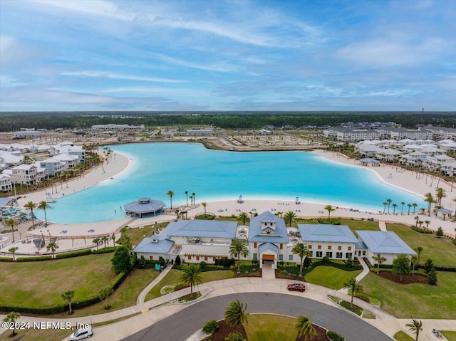 bird's eye view with a water view and a view of the beach