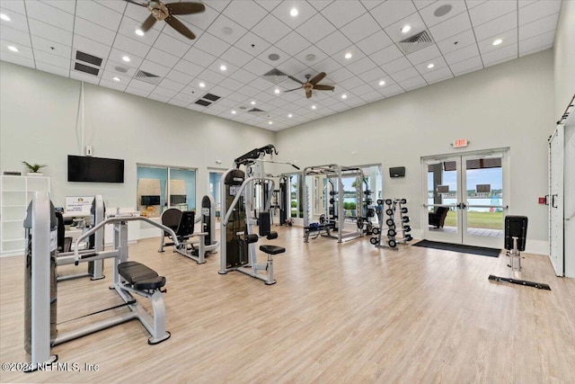 244 Rum Runner Way, Saint Johns, FL 32259 - gym with ceiling fan, a towering ceiling, french doors, light wood-style flooring, and a drop ceiling