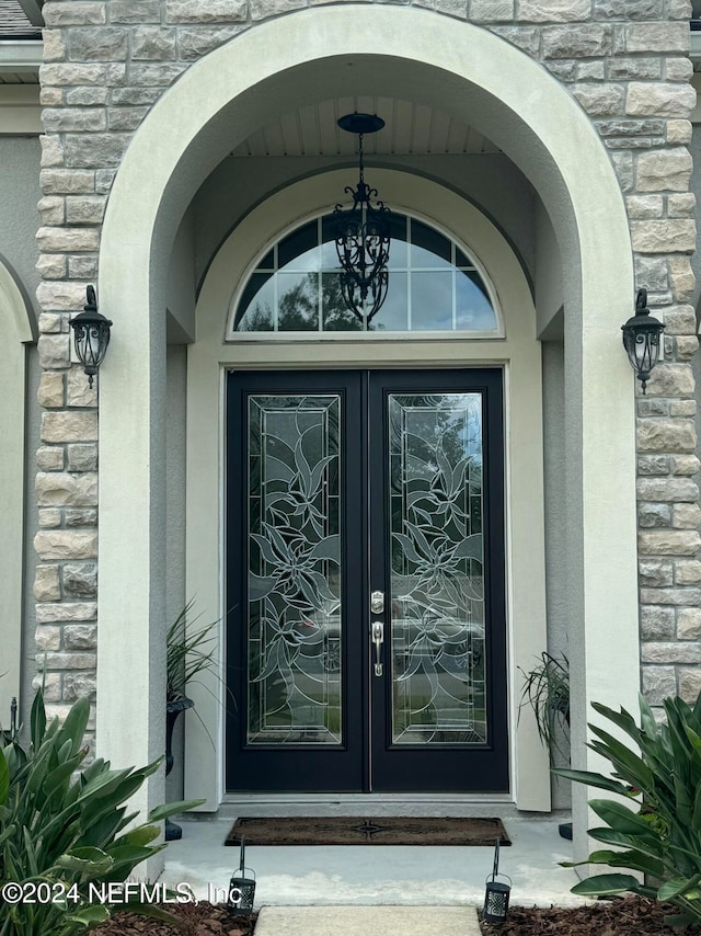 doorway to property featuring french doors