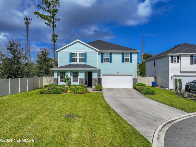 view of front property with a garage and a front yard