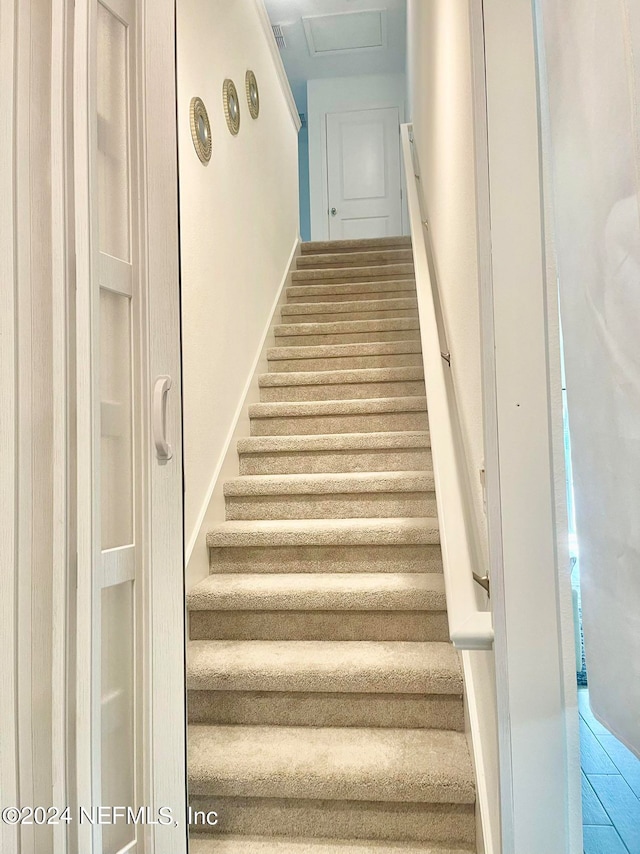 stairs with tile patterned floors