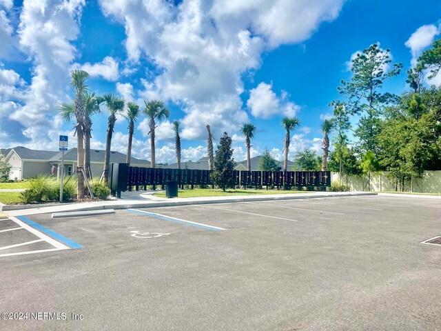 view of vehicle parking featuring a mail area