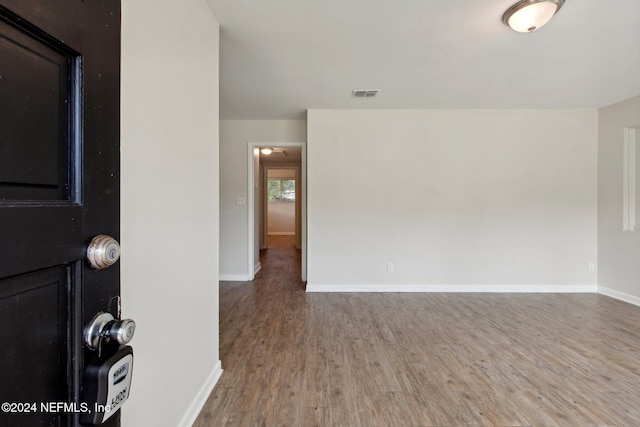 spare room featuring hardwood / wood-style floors