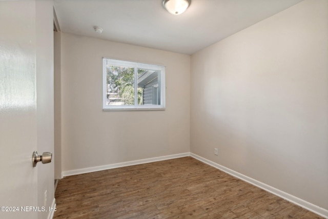 empty room featuring dark hardwood / wood-style floors