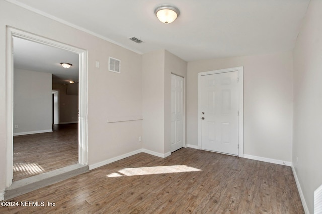 spare room featuring wood-type flooring