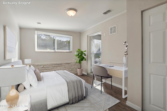 bedroom featuring lofted ceiling and dark hardwood / wood-style floors