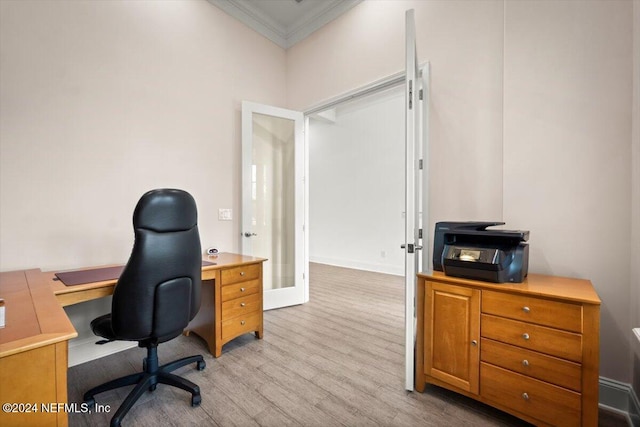 office space featuring ornamental molding and light hardwood / wood-style floors