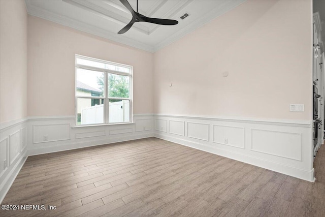 spare room with ceiling fan, crown molding, and light hardwood / wood-style flooring