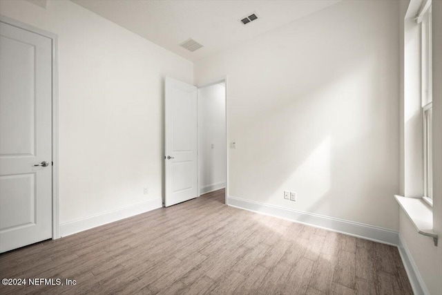 unfurnished room with light hardwood / wood-style flooring