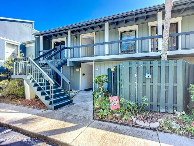 view of front of house featuring a balcony