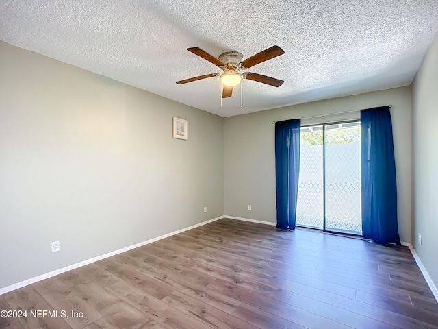 spare room featuring hardwood / wood-style floors, a textured ceiling, and ceiling fan