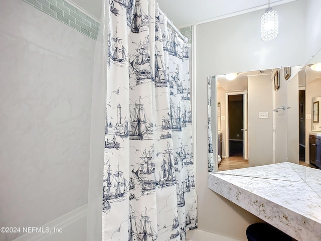 bathroom with vanity and walk in shower