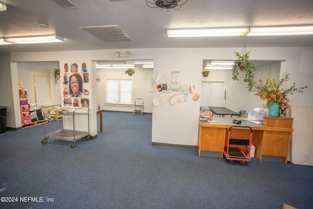 misc room with dark colored carpet