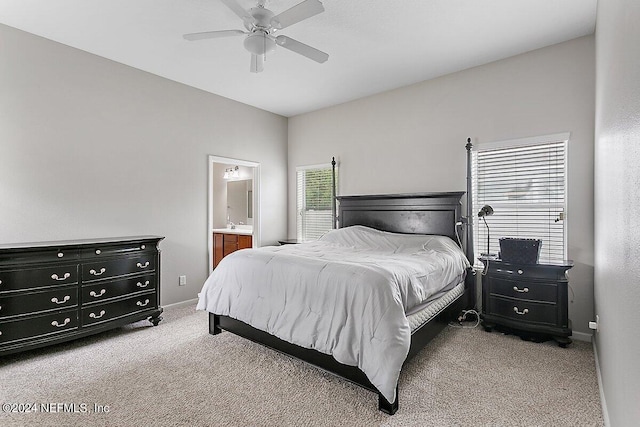 carpeted bedroom featuring connected bathroom and ceiling fan