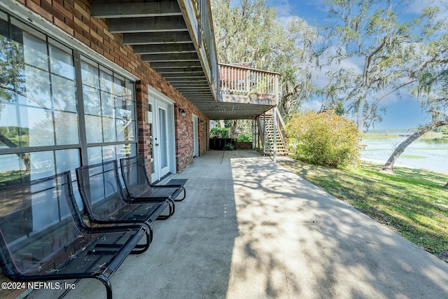 6706 Baja Ct, Keystone Heights, FL 32656 - view of patio / terrace featuring a water view and stairs