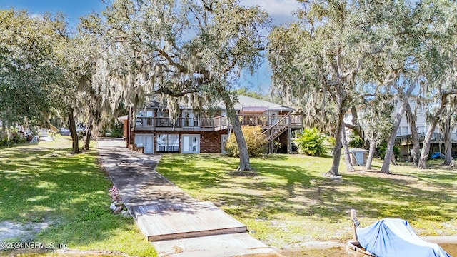 6706 Baja Ct, Keystone Heights, FL 32656 - view of front of property with a wooden deck, a front lawn, and stairway