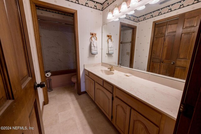 6706 Baja Ct, Keystone Heights, FL 32656 - bathroom with bathtub / shower combination, wallpapered walls, vanity, and toilet