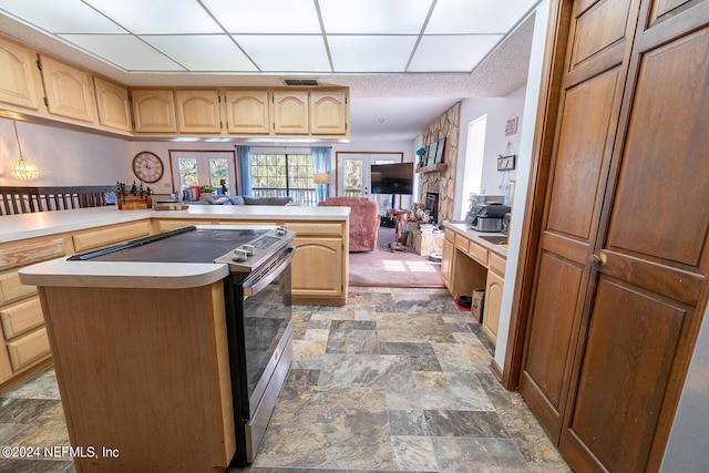 6706 Baja Ct, Keystone Heights, FL 32656 - kitchen featuring stone finish flooring, electric stove, visible vents, and a paneled ceiling