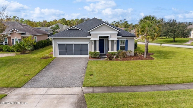 view of front facade with a front yard and a garage