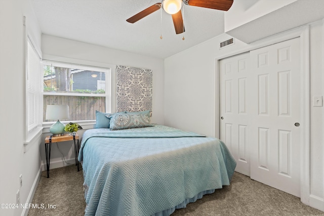 bedroom featuring carpet, a closet, and ceiling fan