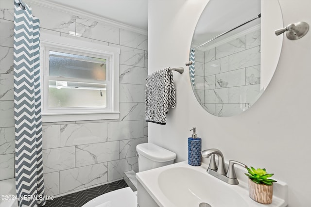 bathroom featuring vanity, toilet, ornamental molding, and curtained shower