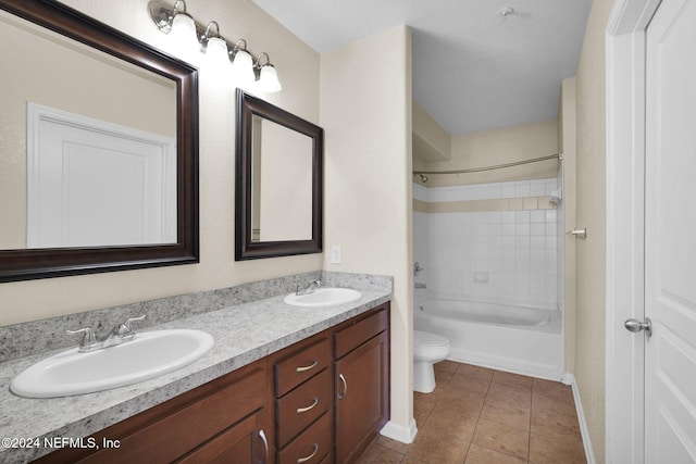 full bathroom featuring vanity, bathing tub / shower combination, toilet, and tile patterned floors