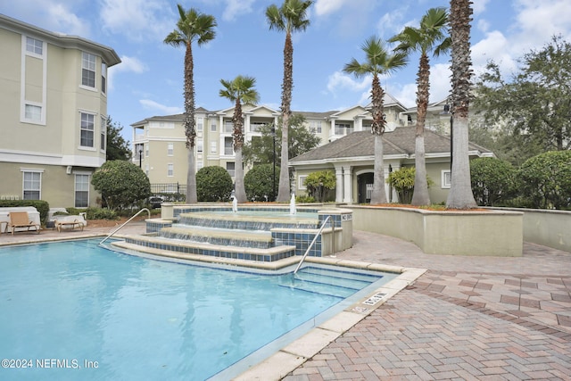 view of pool featuring a patio area