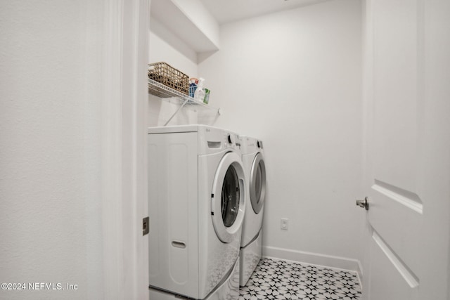 clothes washing area featuring independent washer and dryer