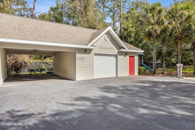 garage featuring a carport