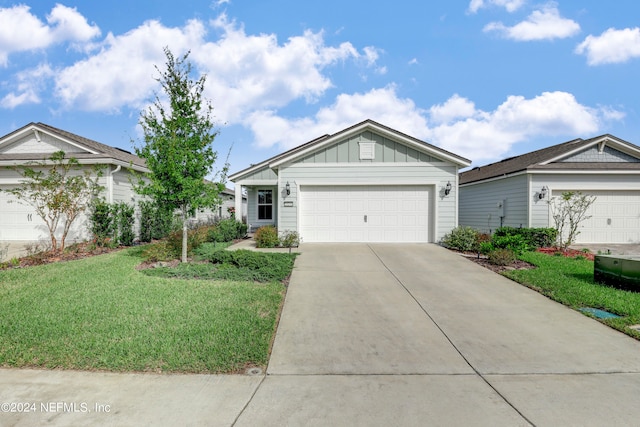 ranch-style house with a front lawn and a garage